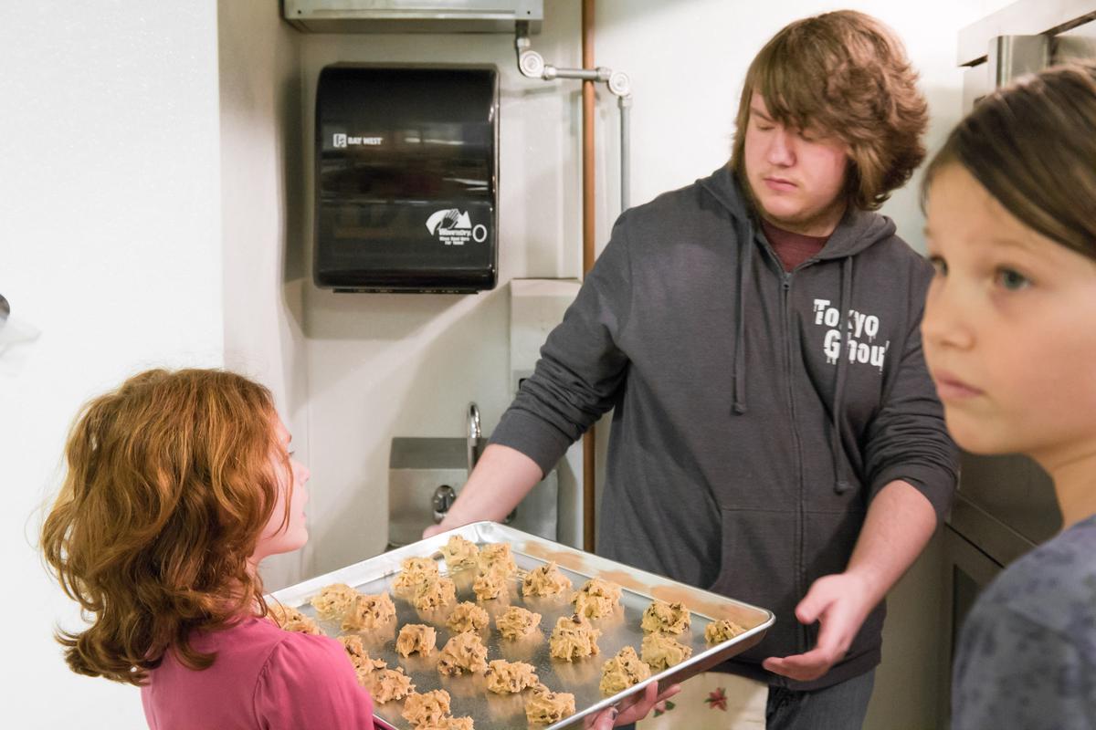 Older and younger in kitchen
